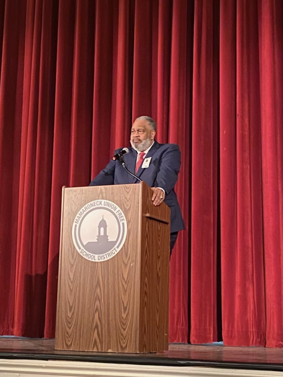 Hinton speaks on stage at McClain Auditorium on March 16th.